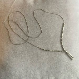 Gold beaded tassel necklace. Approx 16.5 inches in length.